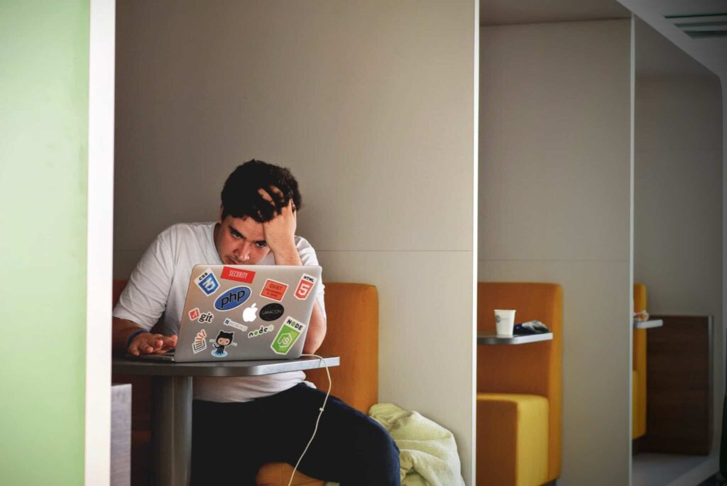 Stressed guy on laptop