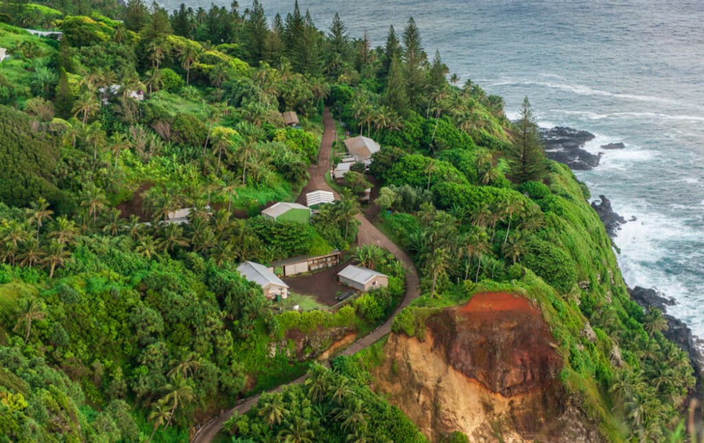 Houses along the coast of Pitcairn Island. Source: Tony Probst