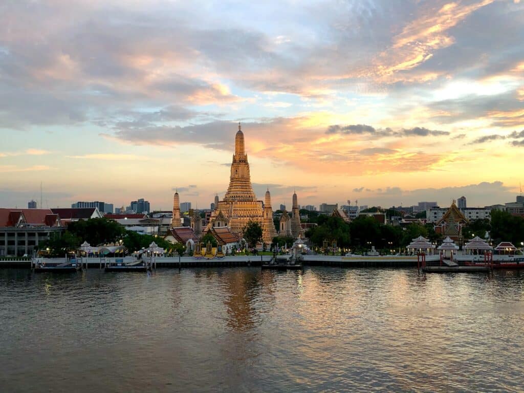 Wat Arun stands tall by the Chao Phraya in Bangkok.